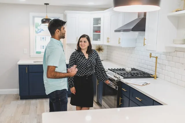 two people looking at an oven
